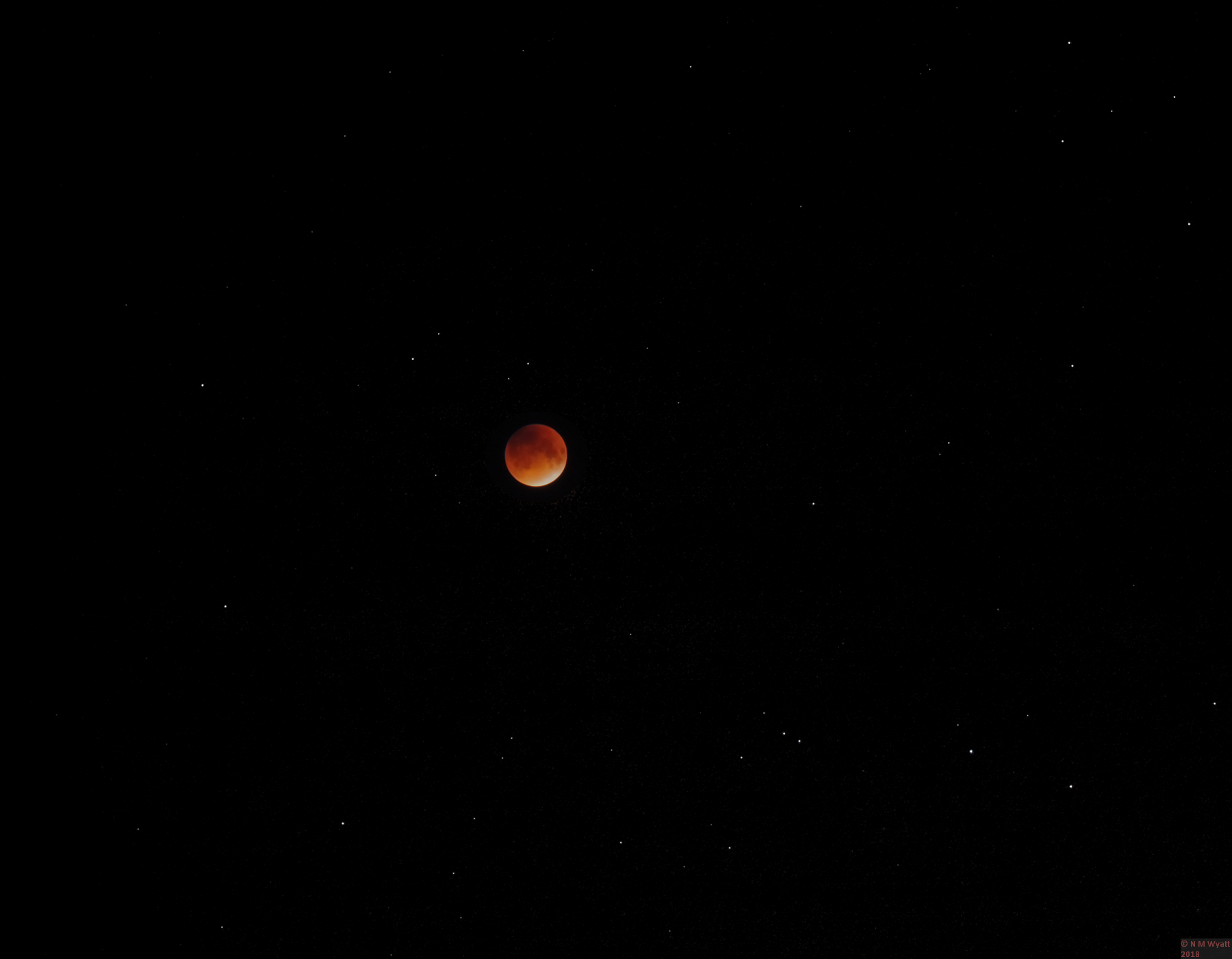 Toatl luner eclipse against a background of scattered stars Toatl luner eclipse against a background of scattered stars